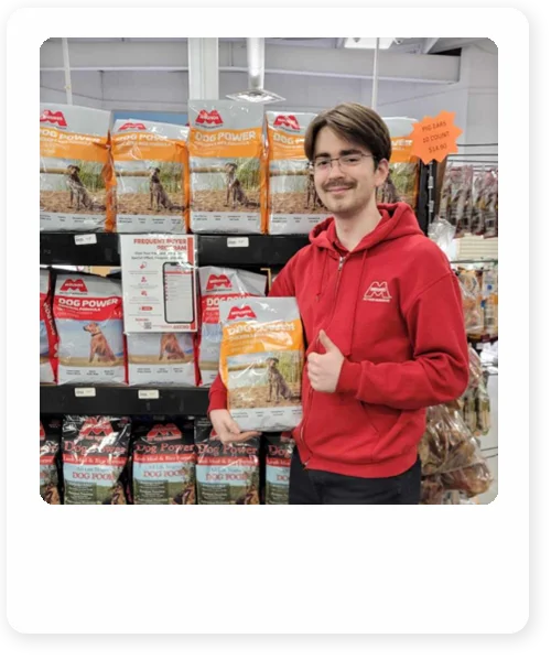 mounds employee holding bag of mounds dog food